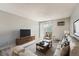 Bright living room with a comfortable couch, a large window, and stylish decor at 451 Golden Cir # 210, Golden, CO 80401