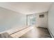 Bright living room with sliding doors that open to a balcony and wood floors at 451 Golden Cir # 210, Golden, CO 80401