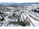 Aerial view of townhome nestled in snowy community at 10872 W Evans Ave # 2E, Lakewood, CO 80227