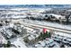 Aerial view of townhome with mountain views and snow at 10872 W Evans Ave # 2E, Lakewood, CO 80227