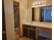 Bathroom with white single sink vanity and a shower with sliding glass door at 10872 W Evans Ave # 2E, Lakewood, CO 80227