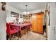 Dining area with red chairs, wooden table, and hutch at 10872 W Evans Ave # 2E, Lakewood, CO 80227