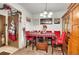 Dining area with a table, chairs, and wooden hutch at 10872 W Evans Ave # 2E, Lakewood, CO 80227