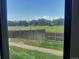 Window view of greenery and clear blue sky at 10872 W Evans Ave # 2E, Lakewood, CO 80227