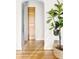 Hallway entrance showing the wooden floor, doorways, and the green tree at 2801 N Garfield St, Denver, CO 80205