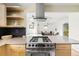 Open-concept kitchen with stainless steel appliances and granite countertops, connected to living area at 2801 N Garfield St, Denver, CO 80205