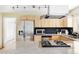 Bright kitchen featuring stainless steel appliances, light wood cabinets, and granite countertops at 2801 N Garfield St, Denver, CO 80205