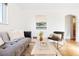 Cozy living room featuring hardwood floors, an eclectic decor, and a comfortable seating arrangement at 2801 N Garfield St, Denver, CO 80205