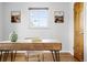 Home office with wooden desk, hardwood floors, and minimalist wall decor at 2801 N Garfield St, Denver, CO 80205