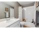 Bathroom featuring a vanity with a single sink, toilet, and a shower/tub with a floral shower curtain at 13850 Meadowbrook Dr, Broomfield, CO 80020