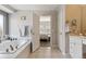 Bathroom with a jacuzzi, neutral color palette and tile floors at 13850 Meadowbrook Dr, Broomfield, CO 80020
