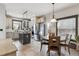 Bright kitchen boasts tile floors, stainless steel appliances, and central island with barstool seating at 13850 Meadowbrook Dr, Broomfield, CO 80020