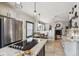 Bright kitchen boasts tile floors, stainless steel appliances and is open to living space at 13850 Meadowbrook Dr, Broomfield, CO 80020