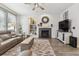 Bright living room features a fireplace and ample seating at 13850 Meadowbrook Dr, Broomfield, CO 80020