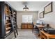 Office space includes hardwood floors, custom cabinetry and a large window for natural light at 13850 Meadowbrook Dr, Broomfield, CO 80020