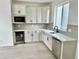 Modern kitchen features white cabinetry, stainless steel appliances, and wine fridge for a stylish and functional cooking space at 16521 Black Rose Cir, Parker, CO 80134