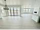 Bright living area with hardwood floors, fireplace, and sliding glass doors leading to the outdoor space at 16521 Black Rose Cir, Parker, CO 80134