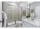 Modern bathroom with a glass-enclosed shower and tiled walls at 9354 Quartz St, Arvada, CO 80007