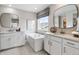 Beautiful bathroom with a soaking tub, and double sinks at 9354 Quartz St, Arvada, CO 80007