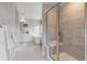 Bathroom featuring a glass-enclosed shower and soaking tub at 9354 Quartz St, Arvada, CO 80007