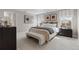 Relaxing bedroom with a plush rug, neutral colors, and a bench at 9354 Quartz St, Arvada, CO 80007
