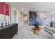 Bright hallway with artwork and a view into the house at 9354 Quartz St, Arvada, CO 80007