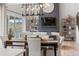 The open concept living area showcases a dining table, comfortable seating, and stylish decor at 9354 Quartz St, Arvada, CO 80007