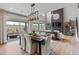 An open-concept living area with large windows, fireplace, and shelving creates a bright, inviting atmosphere at 9354 Quartz St, Arvada, CO 80007