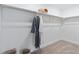 Spacious walk-in closet with ample shelving, hanging space, and neutral carpeting at 9354 Quartz St, Arvada, CO 80007