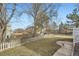 Large backyard with a well-maintained lawn and a classic picket fence at 19827 E Prentice Ave, Centennial, CO 80015