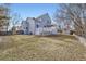 Expansive backyard featuring a large deck, shed, and plenty of space for outdoor activities on a sunny day at 19827 E Prentice Ave, Centennial, CO 80015