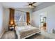 Bedroom with bed, ceiling fan, curtains and natural light at 19827 E Prentice Ave, Centennial, CO 80015