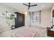 A bedroom featuring a murphy bed and stylish decor at 19827 E Prentice Ave, Centennial, CO 80015