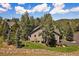 Scenic aerial view of a home nestled in a wooded neighborhood at 31028 Big Bear Dr, Evergreen, CO 80439