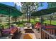 Back deck with comfortable seating, perfect for outdoor relaxation and entertaining at 31028 Big Bear Dr, Evergreen, CO 80439