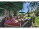 Relaxing outdoor deck featuring comfortable seating and a lush green view at 31028 Big Bear Dr, Evergreen, CO 80439