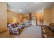 Finished basement living room with a comfortable seating arrangement and a staircase at 31028 Big Bear Dr, Evergreen, CO 80439