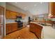 Well-lit kitchen showcases wooden cabinets, modern appliances, and hardwood flooring at 31028 Big Bear Dr, Evergreen, CO 80439