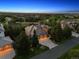 Stunning aerial view of the home, showing lush landscaping and a well-manicured lawn in a desirable neighborhood at 6279 Oxford Peak Pl, Castle Rock, CO 80108