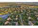 Expansive aerial view of the neighborhood displaying the community layout, lush greenery, and picturesque surroundings at 6279 Oxford Peak Pl, Castle Rock, CO 80108