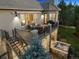 Two-story backyard deck with comfortable seating, a grill, and a relaxing hot tub for outdoor enjoyment at 6279 Oxford Peak Pl, Castle Rock, CO 80108