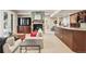 Finished basement with stone fireplace, built-in bar, and cozy seating area, perfect for recreation and relaxation at 6279 Oxford Peak Pl, Castle Rock, CO 80108