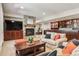 Finished basement with stone fireplace, built-in bar, and cozy seating area, perfect for recreation and relaxation at 6279 Oxford Peak Pl, Castle Rock, CO 80108