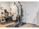 Home gym equipped with modern exercise machines and hardwood floors, designed for fitness enthusiasts at 6279 Oxford Peak Pl, Castle Rock, CO 80108