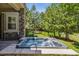 Backyard hot tub surrounded by lush greenery, offering a private and tranquil retreat at 6279 Oxford Peak Pl, Castle Rock, CO 80108