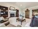 The living room features built-in bookshelves and a cozy fireplace at 6279 Oxford Peak Pl, Castle Rock, CO 80108
