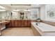 The main bathroom boasts double sinks, a soaking tub, and tile floors at 6279 Oxford Peak Pl, Castle Rock, CO 80108