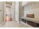 Mud room features tile flooring, a built-in bench with storage, and coat hooks for organization at 6279 Oxford Peak Pl, Castle Rock, CO 80108