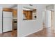 View of the bright kitchen with wood cabinets and modern appliances at 9725 E Harvard Ave # 322, Denver, CO 80231