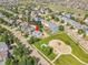 An aerial view of a residential home with neighborhood park and playground at 215 Mcafee Cir, Erie, CO 80516